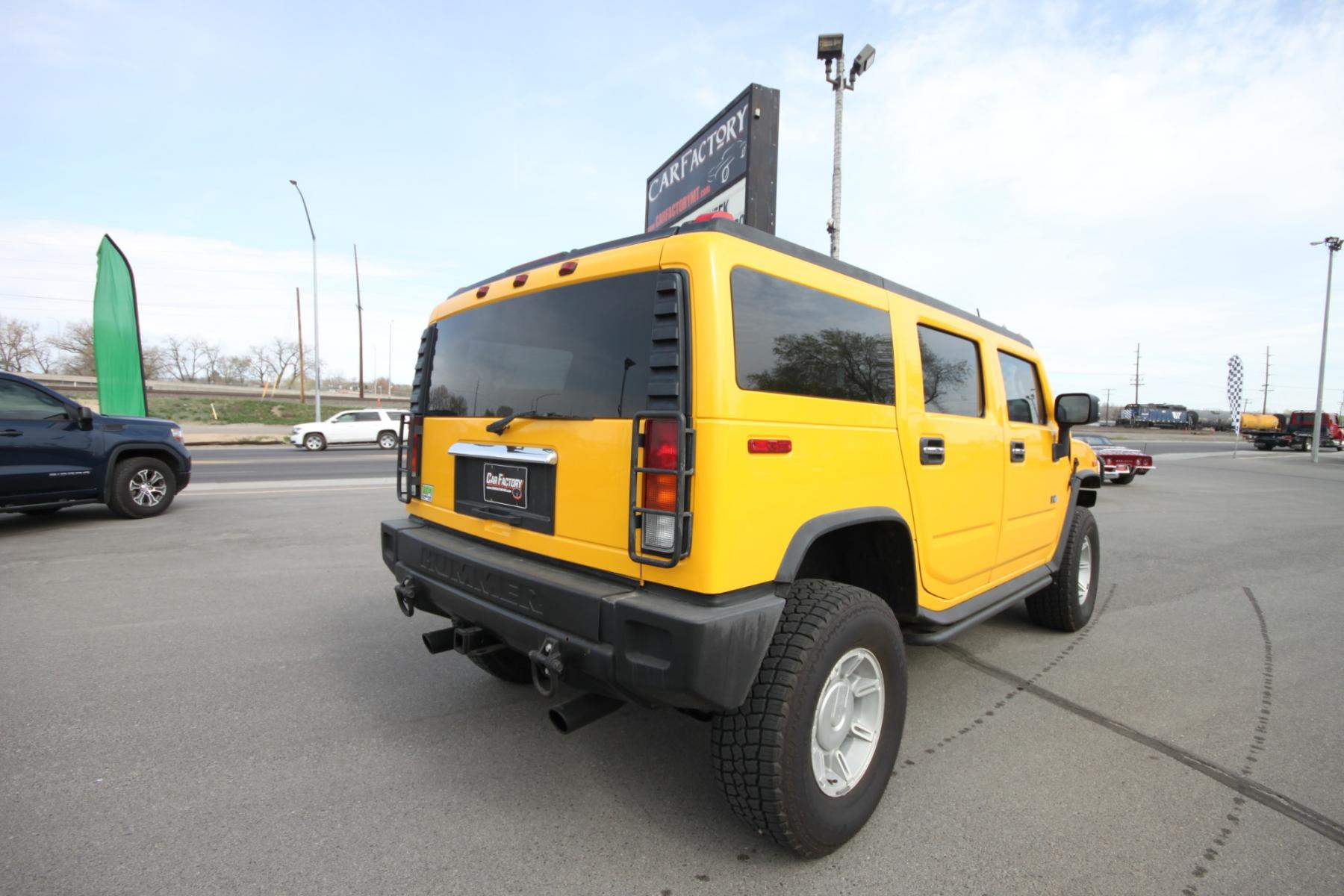 2003 Yellow /Gray Hummer H2 H2 (5GRGN23U73H) with an 6.0 Gasoline V8 engine, 4 speed automatic transmission, located at 4562 State Avenue, Billings, MT, 59101, (406) 896-9833, 45.769516, -108.526772 - 2003 Hummer H2 Sport Utility - Leather & Sunroof! 6.0 gasoline V8 engine - 4 speed heavy duty automatic transmission - 4WD - 106,898 miles Dual zone climate control - air conditioning - tilt steering wheel - cruise control - touchscreen audio (faceplate pulled at time of pictures) - power win - Photo #7